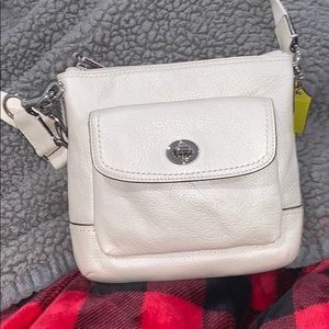 A coach cream purse